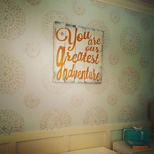 A nursery accent wall that was stenciled with the Antico Allover Stencil from Cutting Edge Stencils. http://www.cuttingedgestencils.com/antico-allover-wall-pattern.html