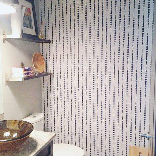 A stenciled bathroom accent wall using the Beads Allover wall pattern from Cutting Edge Stencils. http://www.cuttingedgestencils.com/beads-wall-stencil-pattern.html