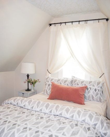A DIY stenciled white and soft gray ceiling in a guest bedroom using the Vison Allover Stencil, a tribal wall pattern, from Cutting Edge Stencils. http://www.cuttingedgestencils.com/allover-stencil-tribal.html