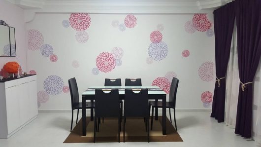 A DIY stenciled dining room accent wall using the three piece Zinnia Grande Stencil, popular flower stencils, from Cutting Edge Stencils. http://www.cuttingedgestencils.com/zinnia-grande-stencil-kit.html