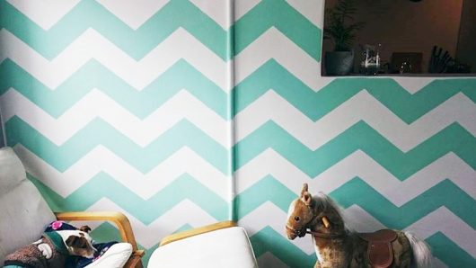 A stenciled playroom accent wall using the Chevron Allover Stencil from Cutting Edge Stencils. http://www.cuttingedgestencils.com/chevron-stencil-pattern.html
