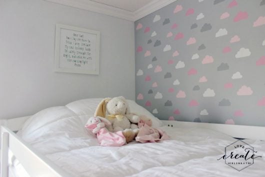 A DIY stenciled accent wall in a girl's bedroom using the Cloud Allover Stencil pattern from Cutting Edge Stencils. http://www.cuttingedgestencils.com/clouds-allover-stencil-pattern-for-walls.html