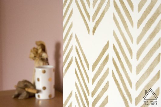 A DIY stenciled accent wall in a bedroom using the Drifting Arrows Allover Stencil from Cutting Edge Stencils. http://www.cuttingedgestencils.com/drifting-arrows-stencil-pattern-diy-decor.html