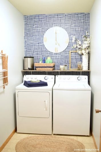 A DIY stenciled accent wall in a laundry room using the Mesh Allover Stencil, a popular geometric grid wall pattern, from Cutting Edge Stencils in Glidden Rich Navy and Silvery Moonlight. http://www.cuttingedgestencils.com/mesh-contemporary-stencil-grid-pattern.html 
