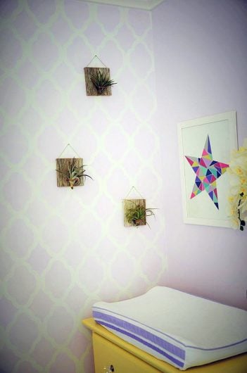 A purple and white stenciled nursery accent wall using the Rabat Allover Stencil, a trendy Moroccan wall pattern, from Cutting Edge Stencils. http://www.cuttingedgestencils.com/moroccan-stencil-pattern-3.html
