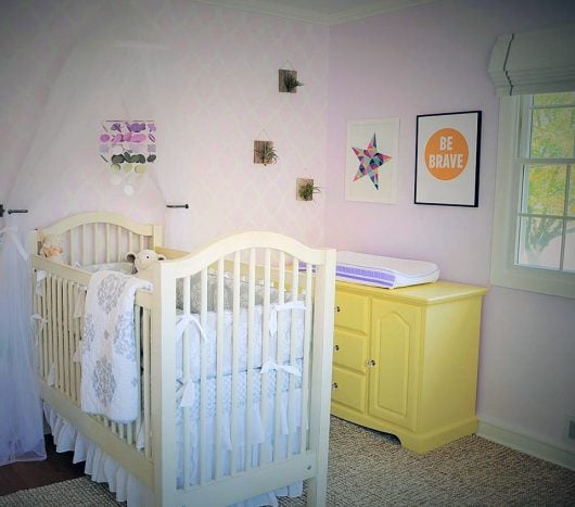 A purple and white stenciled nursery accent wall using the Rabat Allover Stencil, a trendy Moroccan wall pattern, from Cutting Edge Stencils. http://www.cuttingedgestencils.com/moroccan-stencil-pattern-3.html