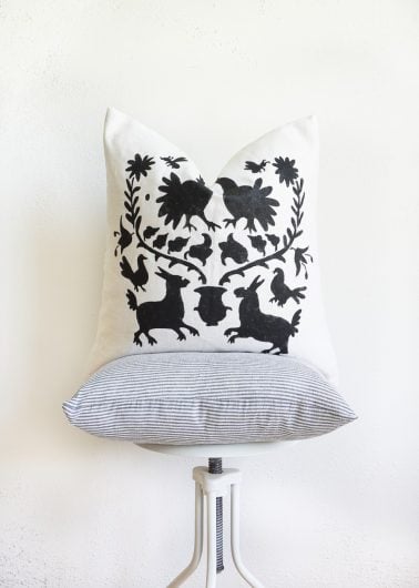 A stenciled custom accent pillow using the Otomi Pillow Stencil, a popular Mexican textile pattern, from Cutting Edge Stencils. http://www.cuttingedgestencils.com/otomi-stencil-for-pillow-kit.html