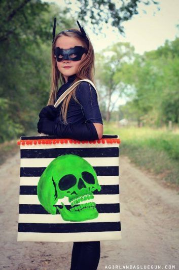 A DIY stenciled trick or treat bag for Halloween using the Skull Stencil from Cutting Edge Stencils. http://www.cuttingedgestencils.com/skull-stencil-diy-halloween-decor-trick-or-treat-tote.html