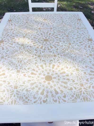 A DIY stenciled dining table using the Stephanie's Lace Allover Stencil from Cutting Edge Stencils in metallic gold. http://www.cuttingedgestencils.com/lace-stencil-wall-decor-stencils.html