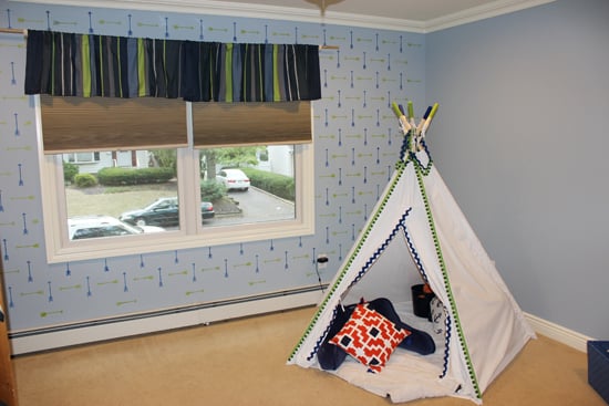 A blue and green stenciled accent wall in a boys bedroom using the Tribal Arrows Allover, a popular arrow motif wall pattern, from Cutting Edge Stencils. http://www.cuttingedgestencils.com/tribal-arrow-pattern-stencils-wall-decor.html