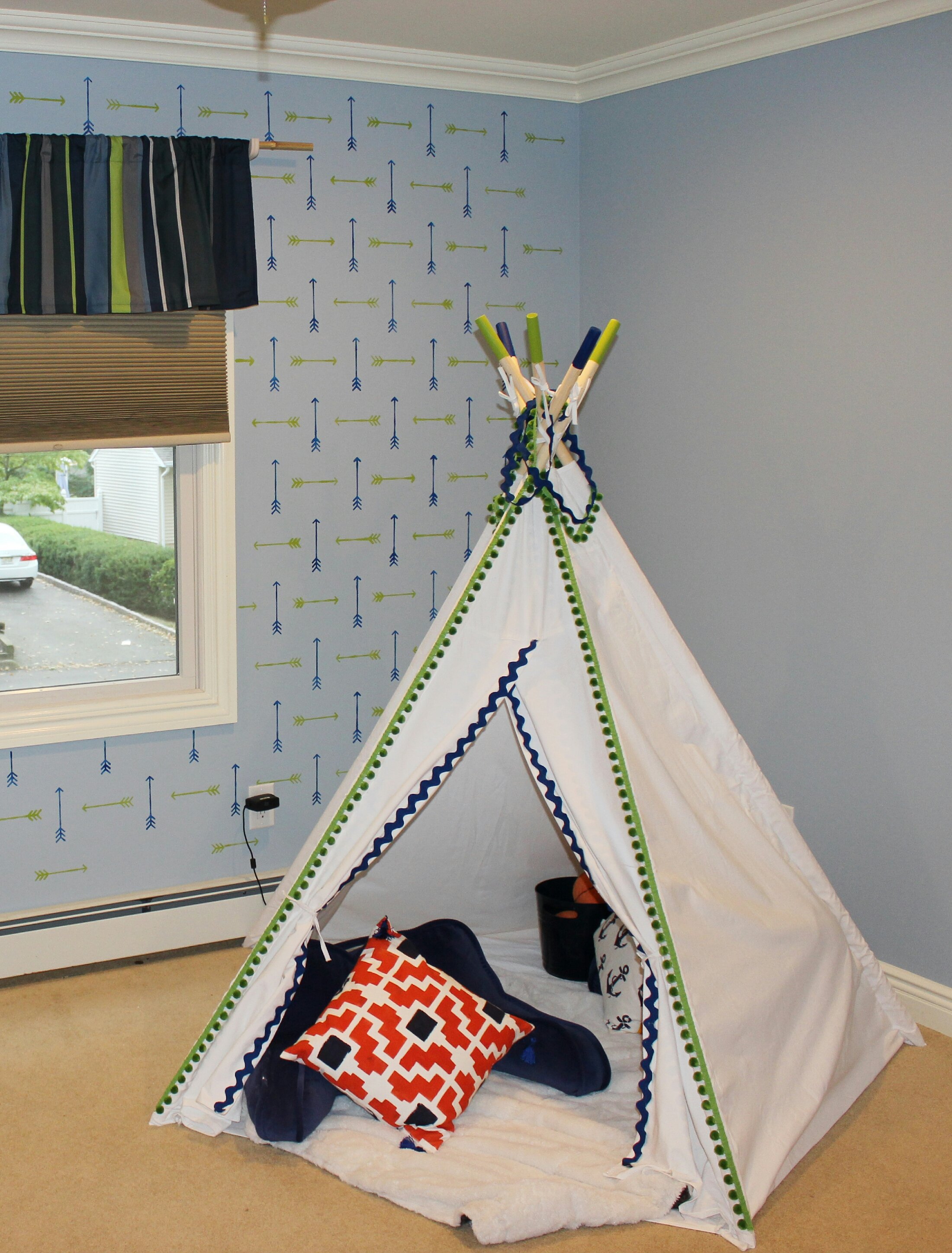 A white canvas teepee in a tribal stenciled boys bedroom using the Tribal Arrows Allover, a popular arrow motif wall pattern, from Cutting Edge Stencils. http://www.cuttingedgestencils.com/tribal-arrow-pattern-stencils-wall-decor.html