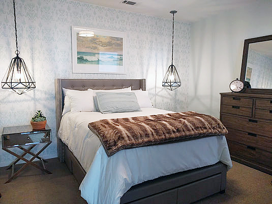 A DIY stenciled bedroom accent wall using the Ikat Bukhara Allover Stencil from Cutting Edge Stencils. http://www.cuttingedgestencils.com/stencil-ikat-damask.html