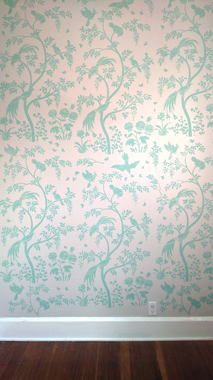 An accent wall using the Chinoiserie Birds and Berries Wall Mural Panel from Cutting Edge Stencils for a wallpaper look, painted in Benjamin Moore's Key Largo Green. http://www.cuttingedgestencils.com/chinoiserie-stencil-mural-wall-design-wallpaper.html