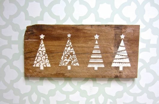 Learn how to stencil reclaimed wood to craft holiday wall art using the Christmas Tree Card Stencils from Cutting Edge Stencils. http://www.cuttingedgestencils.com/scroll-christmas-tree-holiday-card-making-stencil-templates.html