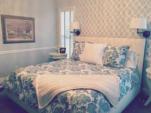 A gray and white stenciled bedroom accent wall using the Rabat Allover Stencil from Cutting Edge Stencils. http://www.cuttingedgestencils.com/moroccan-stencil-pattern-3.html