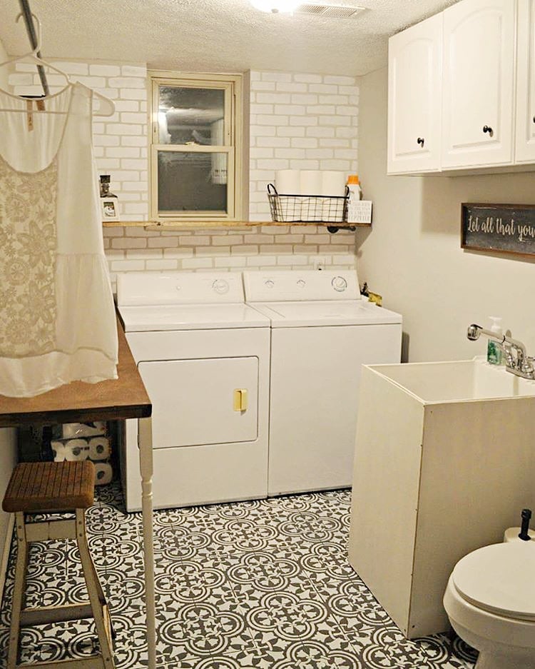 A DIY stenciled laundry room accent wall achieves a subway tile look using the Brick Allover Stencil from Cutting Edge Stencils. http://www.cuttingedgestencils.com/bricks-stencil-allover-pattern-stencils.html