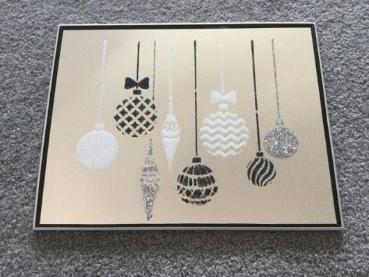 Learn how to stencil a mirror with glitter and the Christmas Ornaments Craft Stencil from Cutting Edge Stencils. http://www.cuttingedgestencils.com/diy-christmas-decor-craft-and-furniture-stencils.html