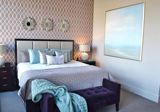 A DIY stenciled purple bedroom accent wall using the Zagora Allover Stencil, a popular Moroccan wall pattern, from Cutting Edge Stencils. http://www.cuttingedgestencils.com/trellis-allover-stencil.html