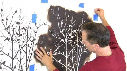 Stenciling a DIY stenciled accent wall using the Birds In Trees Allover Stencil, a nature inspired wallpaper pattern, from Cutting Edge Stencils. http://www.cuttingedgestencils.com/birds-in-trees-wall-stencil-pattern.html
