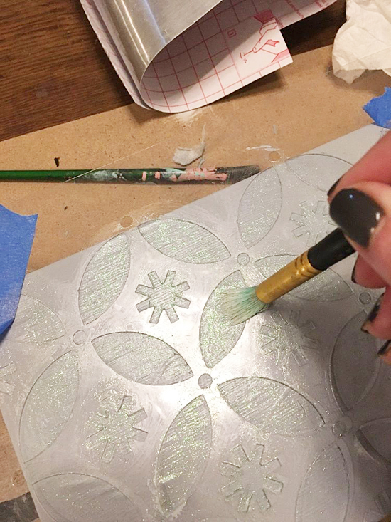 Learn how to make a DIY gift box from a Whitman Sampler box and the Holiday Cheer Craft stencil from Cutting Edge Stencils. http://www.cuttingedgestencils.com/christmas-stencils-designs-holiday-cheer.html