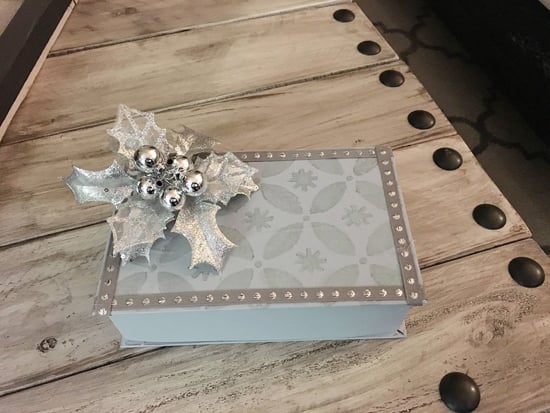 A DIY stenciled holiday gift box using the Holiday Cheer Craft Stencil from Cutting Edge Stencils. http://www.cuttingedgestencils.com/christmas-stencils-designs-holiday-cheer.html