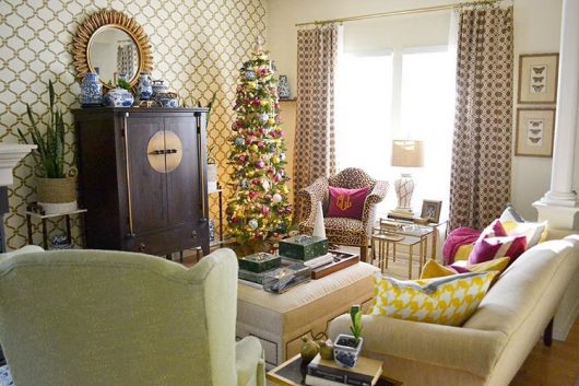 Holiday decorating in a living room with a stenciled accent wall using the Heritage Grill Stencil from Cutting Edge Stencils. http://www.cuttingedgestencils.com/heritage-grill-allover-stencil.html