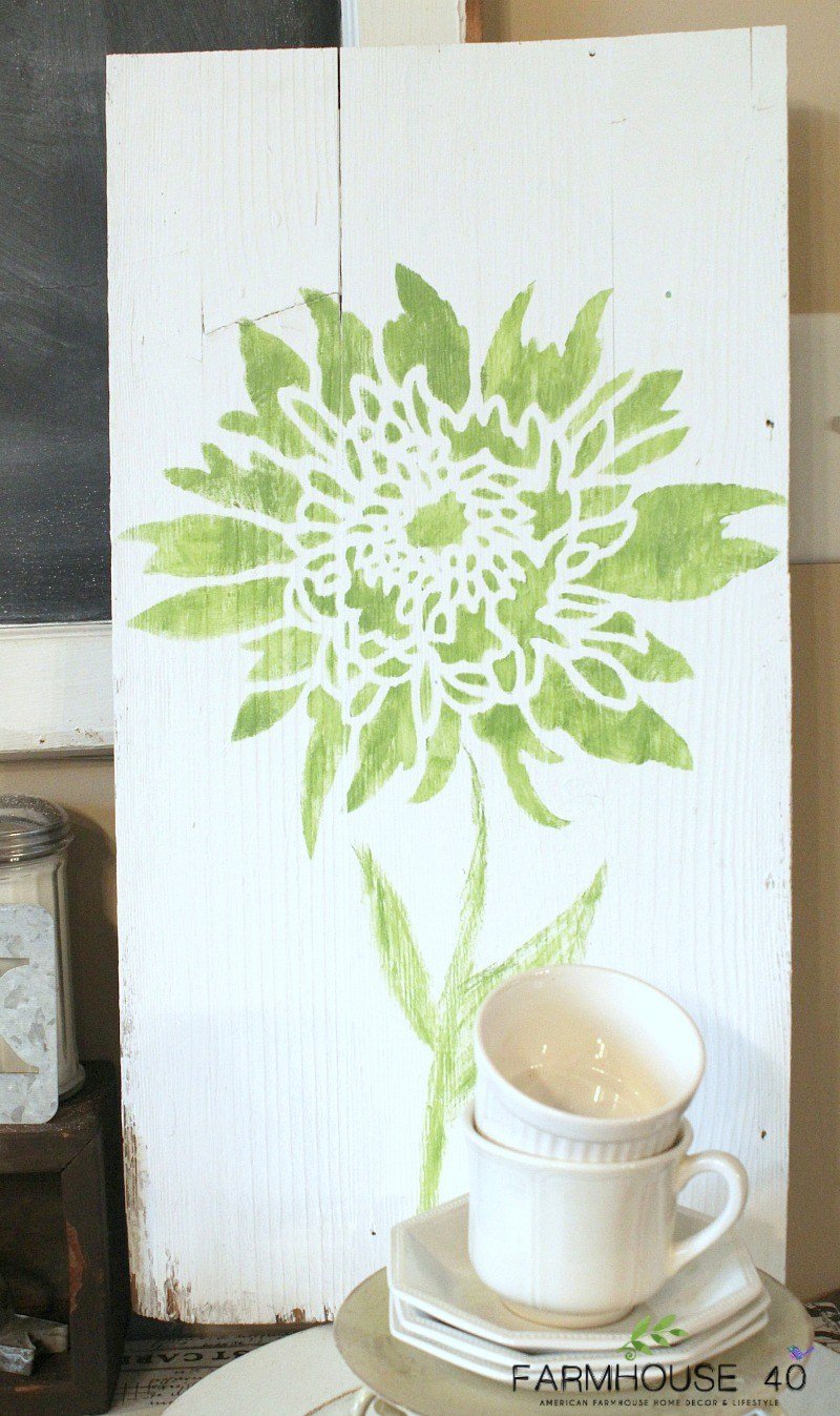 DIY stenciled wall art using wood and the Chrysanthemum Grande Flower Stencil from Cutting Edge Stencils. http://www.cuttingedgestencils.com/flower-stencil-4.html
