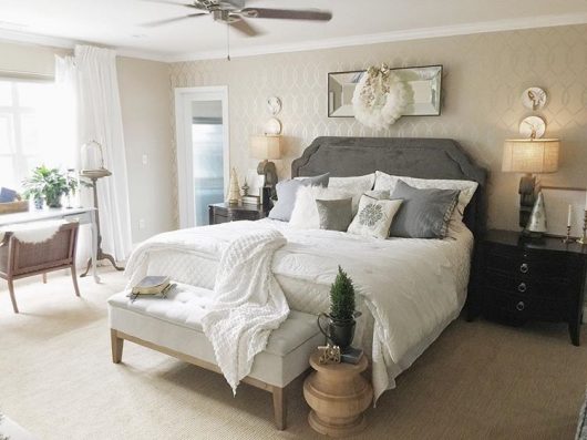 A neutral colored bedroom with a metallic silver stenciled accent wall using the Entwined Allover Stencil from Cutting Edge Stencils. http://www.cuttingedgestencils.com/stencil-pattern-2.html