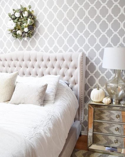 A gray and white stenciled accent wall in a master bedroom using the Rabat Allover Stencil from Cutting Edge Stencils. http://www.cuttingedgestencils.com/moroccan-stencil-pattern-3.html