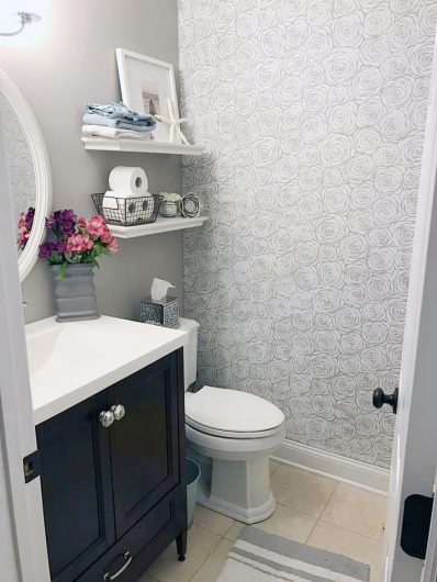 A DIY stenciled bathroom accent wall using the Roses Allover Stencil from Cutting Edge Stencils. http://www.cuttingedgestencils.com/roses-stencil-pattern-rose-design.html