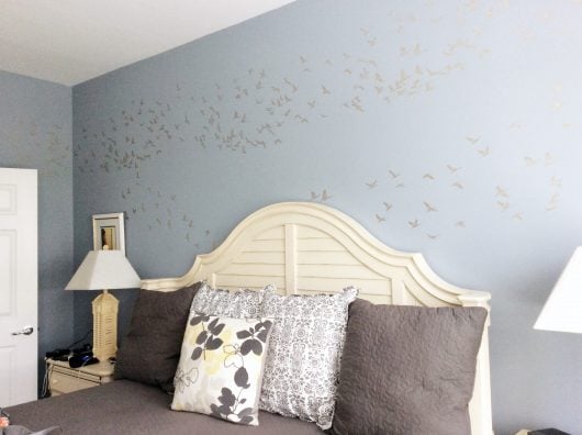 A DIY blue and beige stenciled bedroom accent wall using the Flock of Cranes Allover Stencil from Cutting Edge Stencils. http://www.cuttingedgestencils.com/bird-flock-wall-stencil-pattern.html