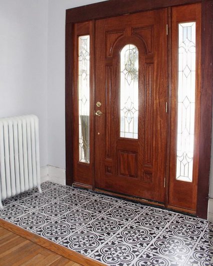 A black and white DIY stenciled entryway floor using the Augusta Tile Stencil from Cutting Edge Stencils. http://www.cuttingedgestencils.com/augusta-tile-stencil-design-patchwork-tiles-stencils.html