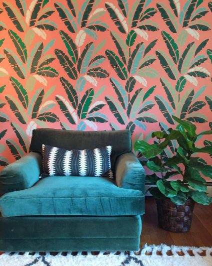 A stenciled accent wall based on the trendy Martinique Wallpaper painted with the Banana Leaf Allover Stencil from Cutting Edge Stencils. http://www.cuttingedgestencils.com/banana-leaf-stencil-tropical-wallpaper-palm-leaves-print.html