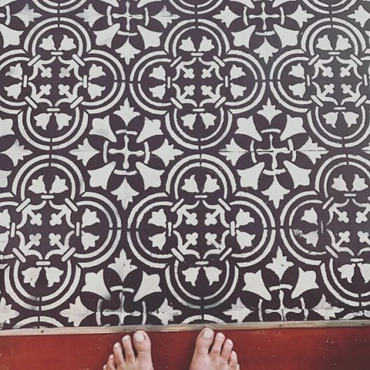 A black and white DIY stenciled floor using the Augusta Tile Stencil from Cutting Edge Stencils. http://www.cuttingedgestencils.com/augusta-tile-stencil-design-patchwork-tiles-stencils.html