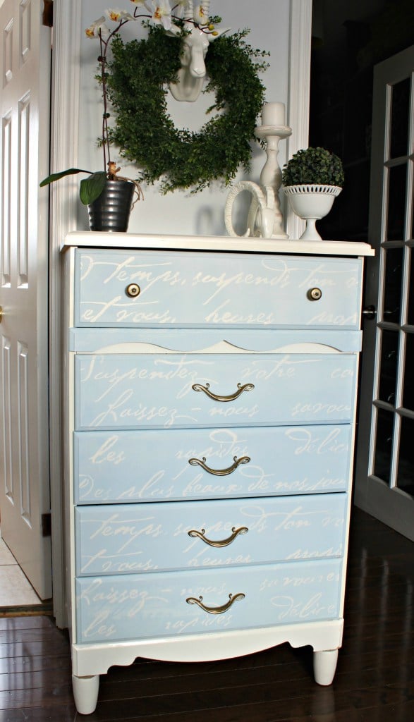 A DIY blue and white stenciled dresser using the French Poem Allover Stencil from Cutting Edge Stencils. http://www.cuttingedgestencils.com/french-typography-letter-wall-stencil.html