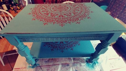 A teal and metallic copper DIY stenciled and painted coffee table makeover using the Prosperity Mandala Stencil from Cutting Edge Stencils. http://www.cuttingedgestencils.com/prosperity-mandala-stencil-yoga-mandala-stencils-designs.html