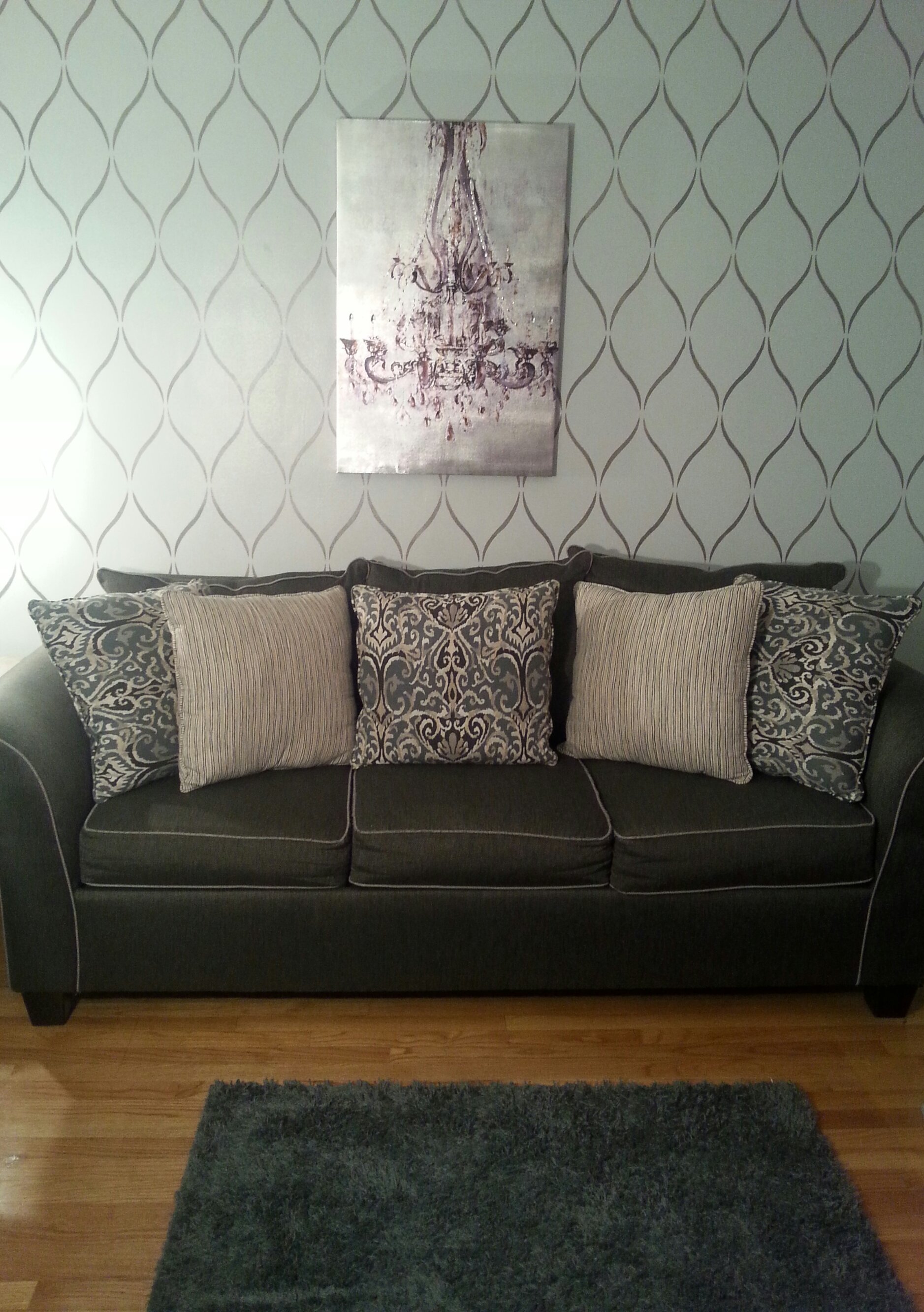 A DIY stenciled living room accent wall using the Serenity Allover Stencil from Cutting Edge Stencils. http://www.cuttingedgestencils.com/serenity-allover-stencil-trellis-design-wall-pattern-diy-decor.html