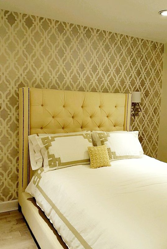 A golden yellow DIY stenciled bedroom accent wall using the Tamara Trellis Allover Stencil from Cutting Edge Stencils. http://www.cuttingedgestencils.com/tamara-trellis-allover-wall-stencils.html