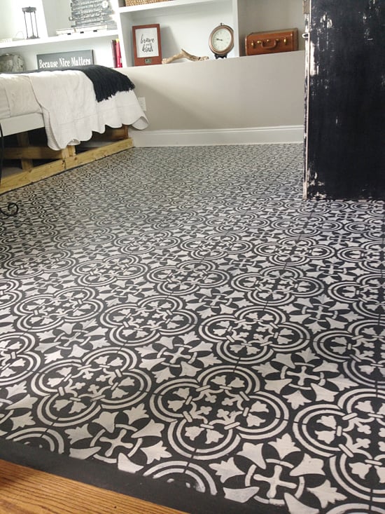 A guest bedroom with a stenciled plywood floor using the Augusta Tile Stencil from Cutting Edge Stencils. http://www.cuttingedgestencils.com/augusta-tile-stencil-design-patchwork-tiles-stencils.html