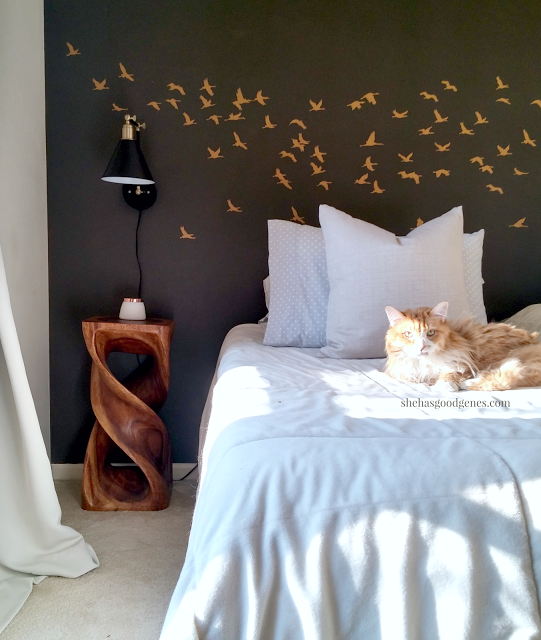 A DIY stenciled bedroom accent wall in dark gray and metallic gold using the Flock of Cranes from Cutting Edge Stencils. http://www.cuttingedgestencils.com/bird-flock-wall-stencil-pattern.html
