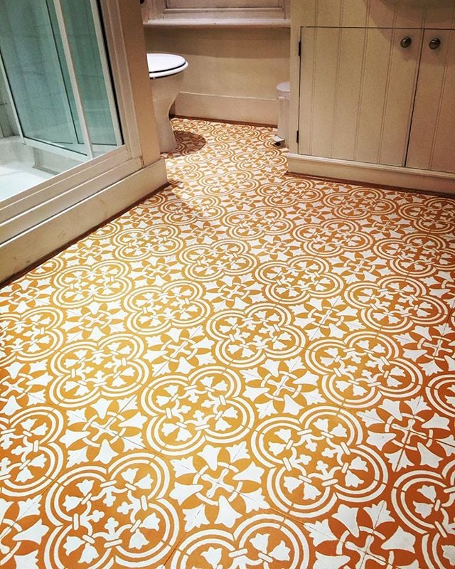 A DIY painted and stenciled vinyl tile floor in a bathroom using the Augusta Tile Stencil from Cutting Edge Stencils. http://www.cuttingedgestencils.com/augusta-tile-stencil-design-patchwork-tiles-stencils.html