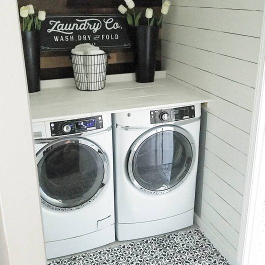 A black and white DIY stenciled and painted laundry room floor using the Augusta Tile Stencil from Cutting Edge Stencils. http://www.cuttingedgestencils.com/augusta-tile-stencil-design-patchwork-tiles-stencils.html 