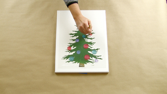 Learn how to make DIY light up Christmas Tree artwork using a craft stencil from Cutting Edge Stencils. http://www.cuttingedgestencils.com/christmas-tree-stencil.html