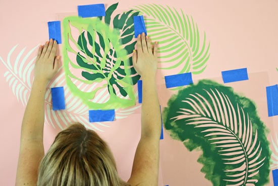 Overlapping palm fronds stencil to create tropical wall design