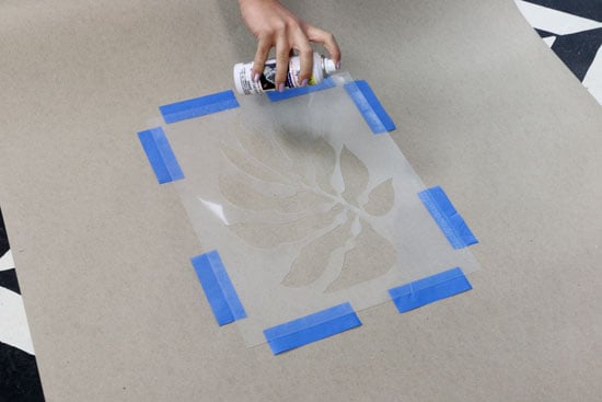 Spray adhesive to back of the stencil