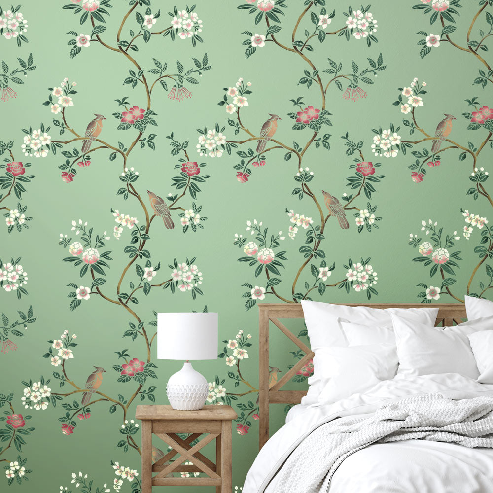 avian chinoiserie stencil pattern on green bedroom wall