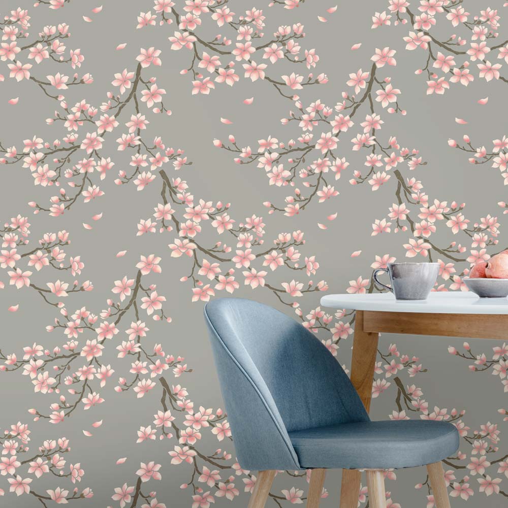 Magnolia blossom wallpaper with a blue chair and table in the foreground