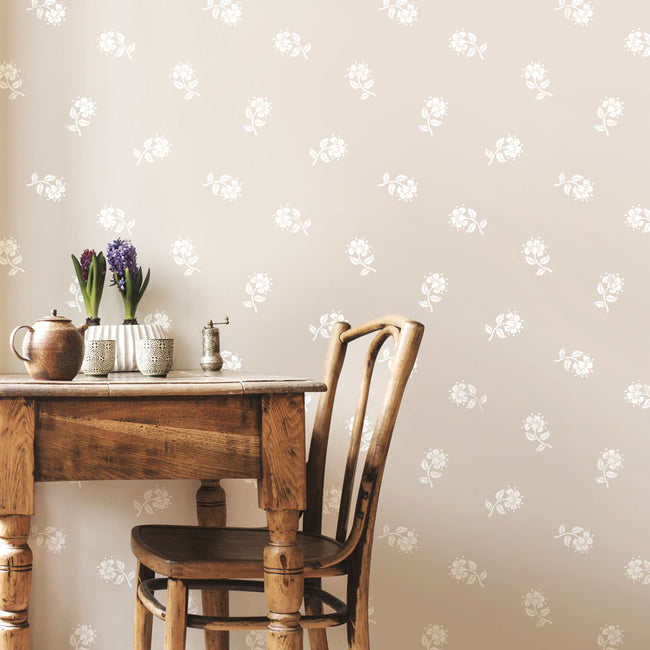 beige wall with white cottage pinks flower stencil
