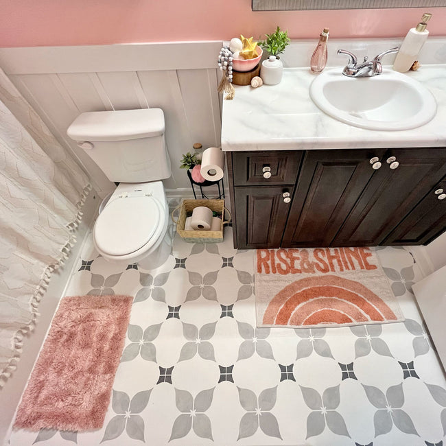 Dogwood Tile Stencil in Grey on a bathroom floor