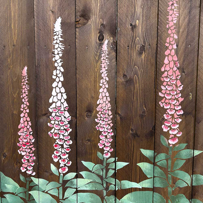 Hand-painted foxglove flowers on a wooden background stenciled fence